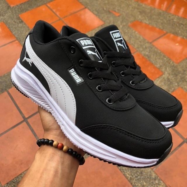 Puma black sale white shoes