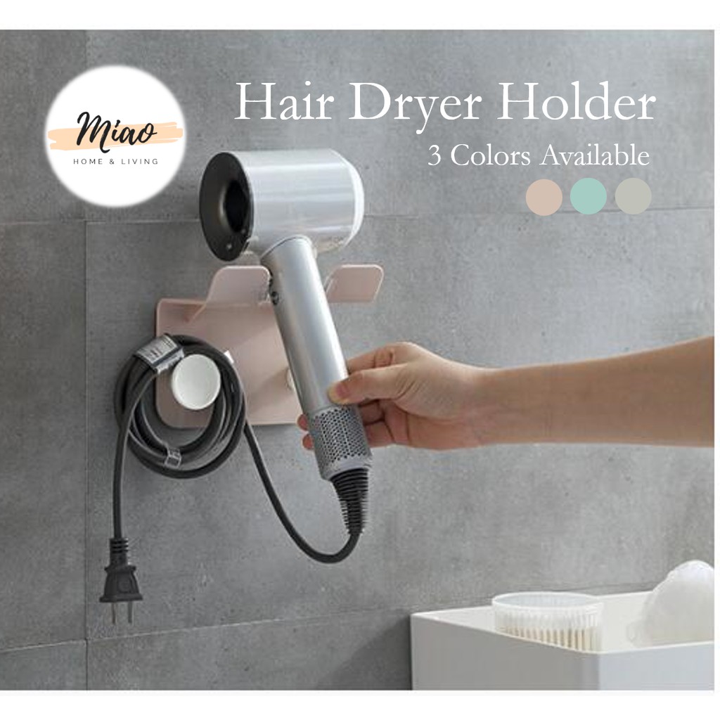 Hair dryer outlet hanger