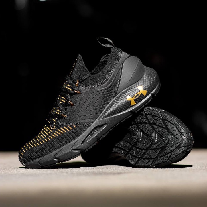 Under armour shoes black sale and gold