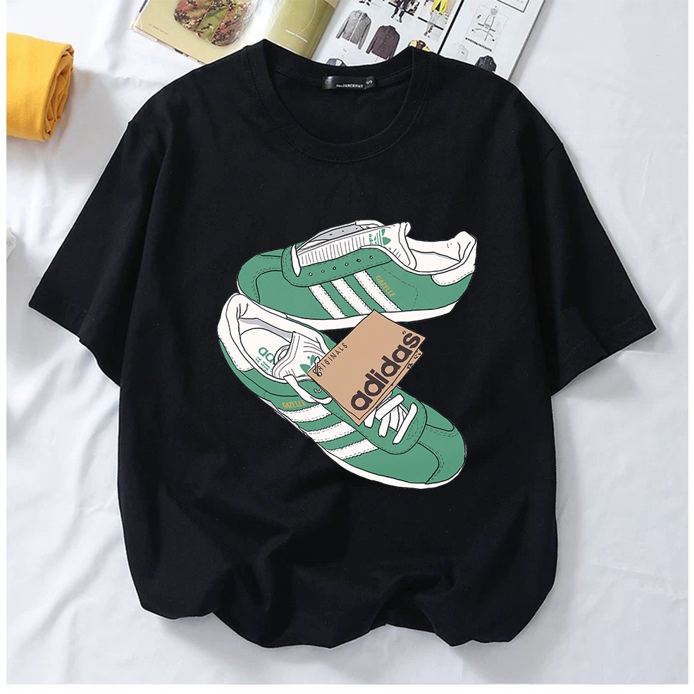 Adidas t shirt with trainers 2024 on it