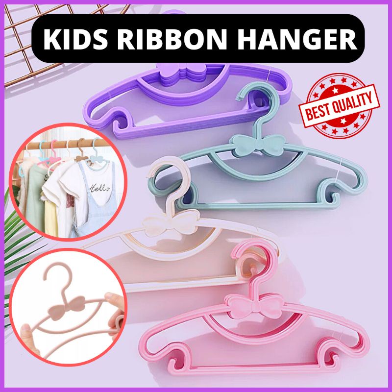 Premium Photo  Clothes for kids on hangers