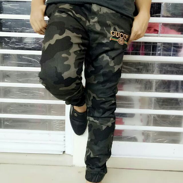 Gucci store camo pants