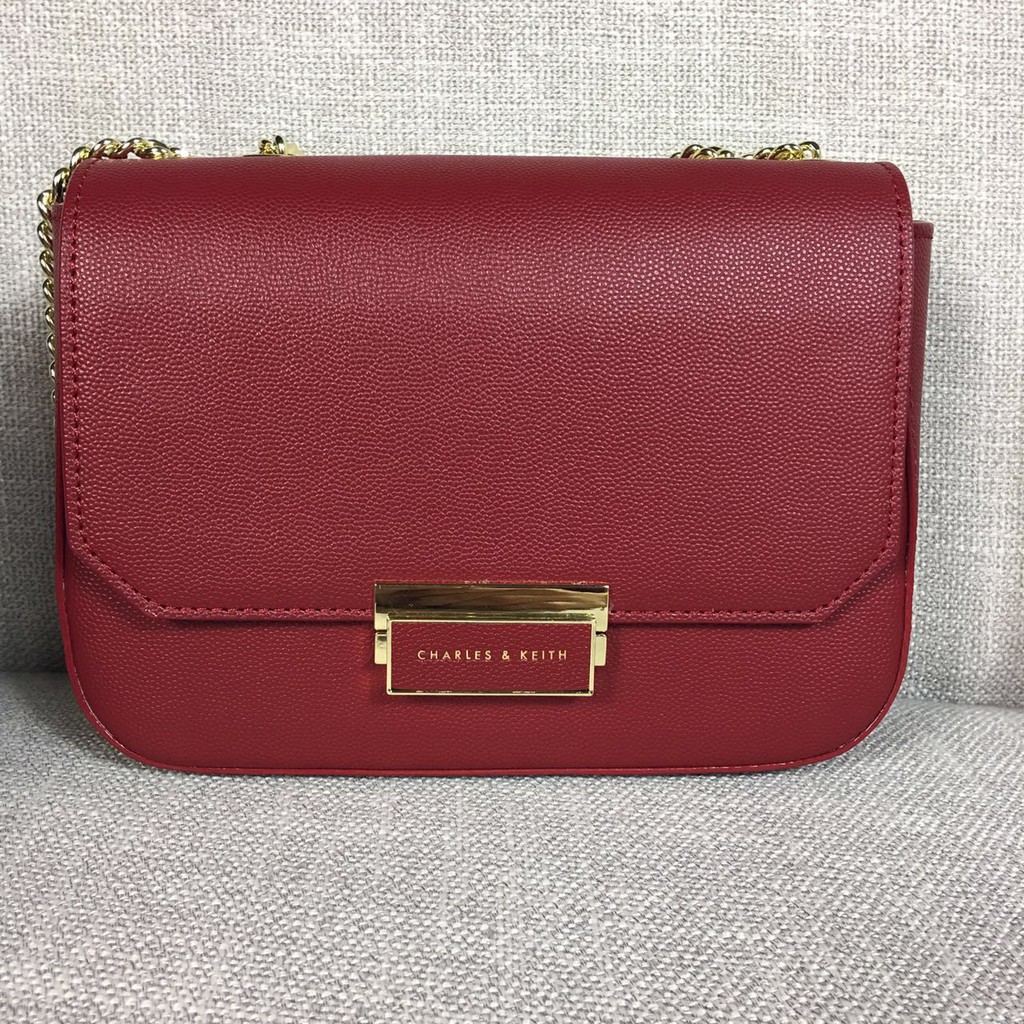 Charles and keith 2024 red sling bag