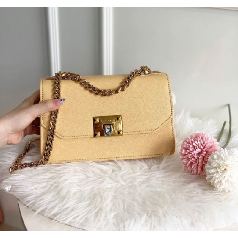 Metal push best sale lock crossbody bag