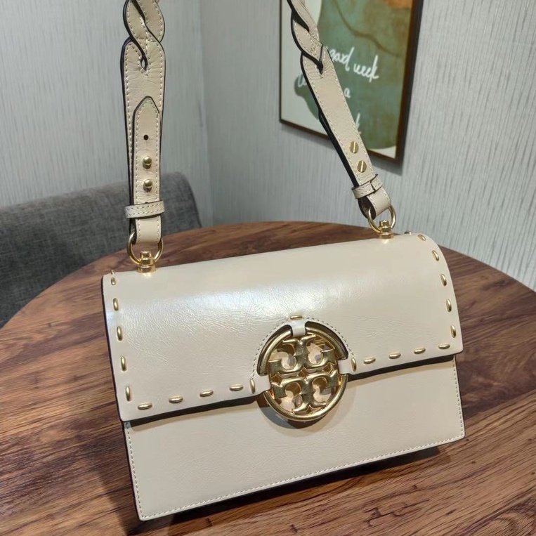 Cowhide best sale tory burch