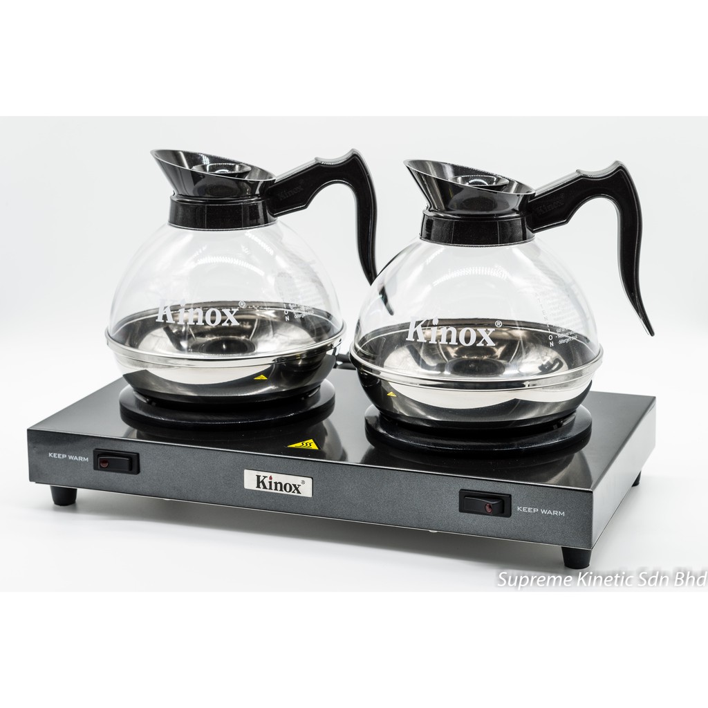 Coffee decanter outlet warmer