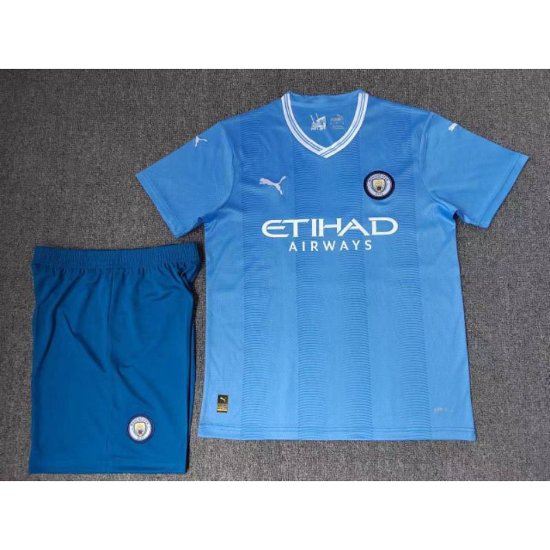 Man city best sale kids jersey