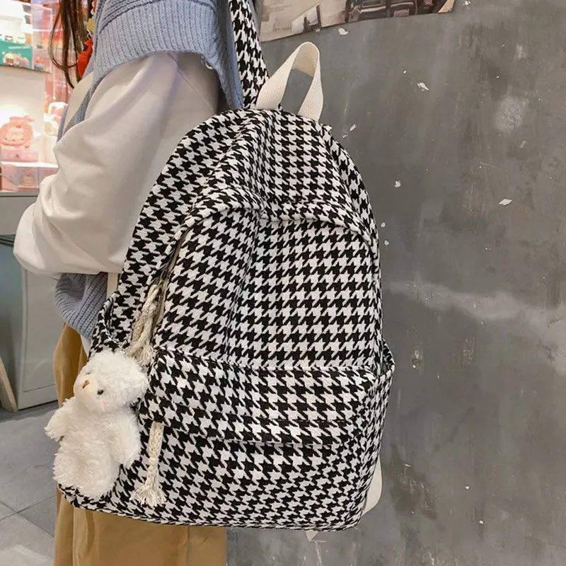 Black and 2024 white plaid backpack